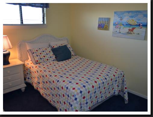 rear guest bedroom with walk in closet