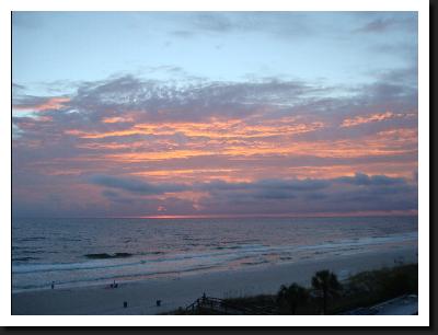 sunset from balcony at Moonspinner beach resort panama city beach florida